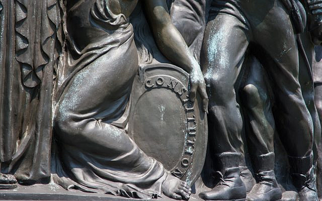 The Confederate Memorial at Arlington National Cemetery includes the image of a woman protecting a shield emblazoned with the word "Constitution." (Tim Evanson/Flickr Commons)