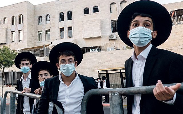 Ultra Orthodox young Jewish men with masks on in Jerusalem. (Credit Image: © Nir Alon/ZUMA Wire)