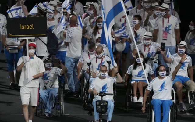 Athletes from Israel enter the stadium during the opening ceremony for the 2020 Paralympics at the National Stadium in Tokyo, Tuesday, Aug. 24, 2021. (AP Photo/Emilio Morenatti)