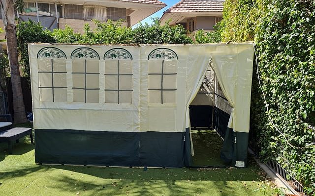 Our sukkah, near the lemon tree. (courtesy) Our sukkah, near the lemon tree. (courtesy)