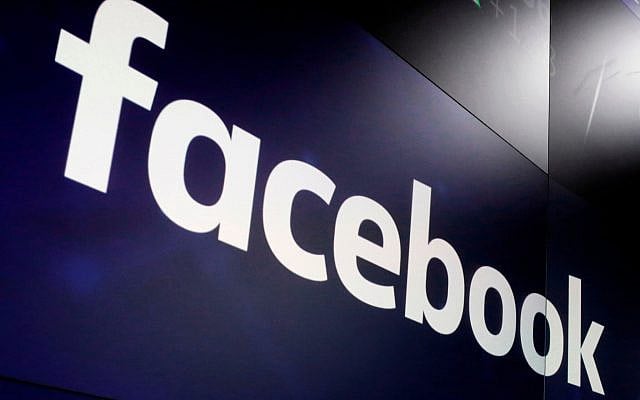 The logo for Facebook appears on screens at the Nasdaq MarketSite in New York's Times Square, March 29, 2018. (AP Photo/ Richard Drew, File)