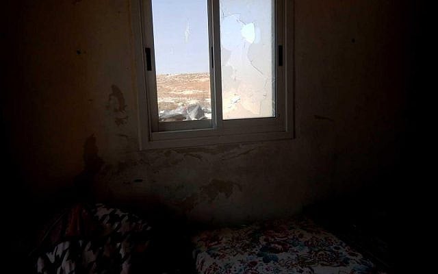 A window smashed by the settlers in al-Mufaqara. Photo by Manal al-Ja’bari, B'tselem