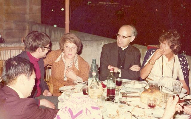 Gita (center) and friends, including Father Zerafa, to her left. (courtesy)