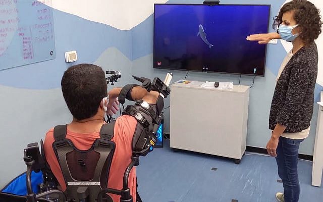 A rehabilitation patient works with a specialist to enhance arm strength and motor function at the ADI Negev-Nahalat Eran Rehabilitation Village.