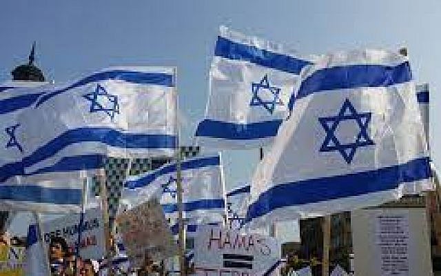 Israeli flags at a pro-Israel march, via Creative Commons