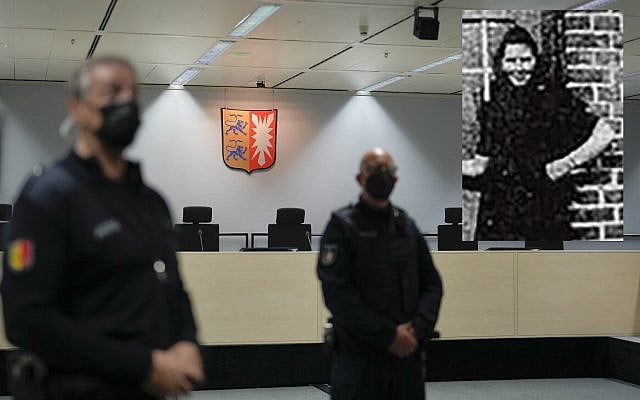 Judicial officers stand in the empty court room of the Langericht Itzehoe court prior to the trial of a 96-year-old former secretary of the SS commander of the Stutthof concentration camp in Itzehoe, Germany, September 30, 2021. (AP Photo/ Markus Schreiber, Pool). Inset shows Irmgard Furchner.