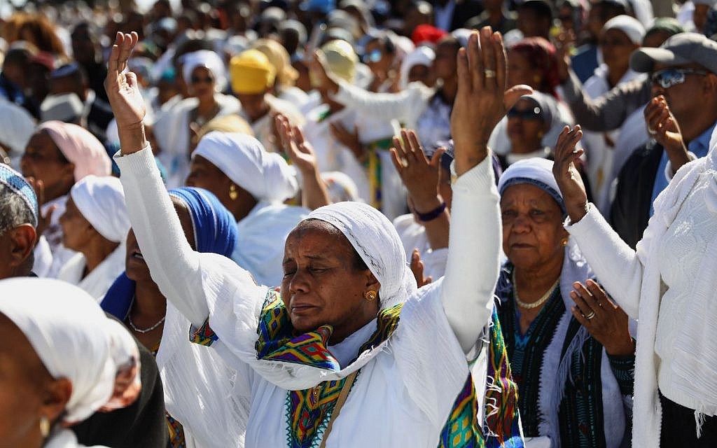 Israeli women from the Ethiopian Jewish community pray during the Sigd holiday from a hilltop overlooking the Temple Mount in Jerusalem, Israel, Nov. 27, 2019. (Gali Tibbon/AFP via Getty Images)