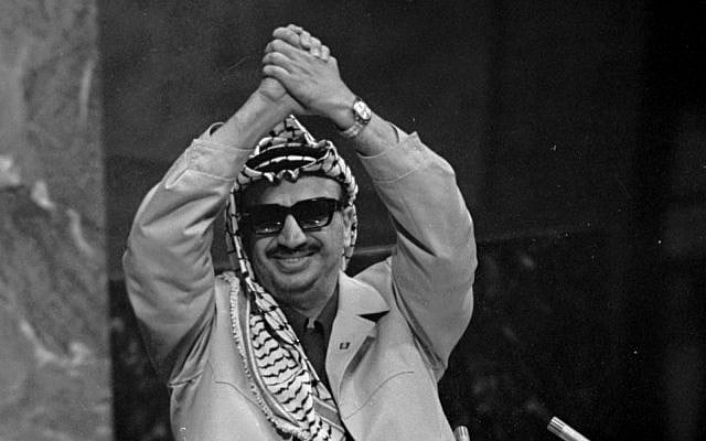 Nov. 13, 1974 file photo: Yasser Arafat addresses the United Nations General Assembly. Arafat had been invited to represent the PLO and his people before the world body, where he said: 'Today I have come bearing an olive branch and a freedom fighter's gun. Do not let the olive branch from my hand.' (AP Photo/Marty Lederhandler, File)