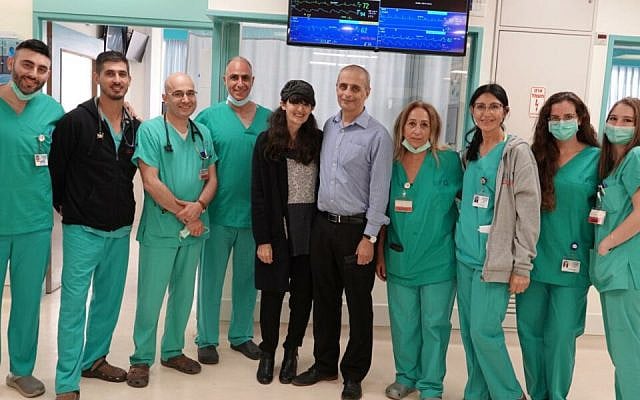 Eliezer and Shira Be'eri with doctors and nurses of the cardiac intensive care unit at Shaare Zedek Hospital (Courtesy Shaare Zedek Hospital) Eliezer and Shira Be'eri with doctors and nurses of the cardiac intensive care unit at Shaare Zedek Hospital (Courtesy Shaare Zedek Hospital)