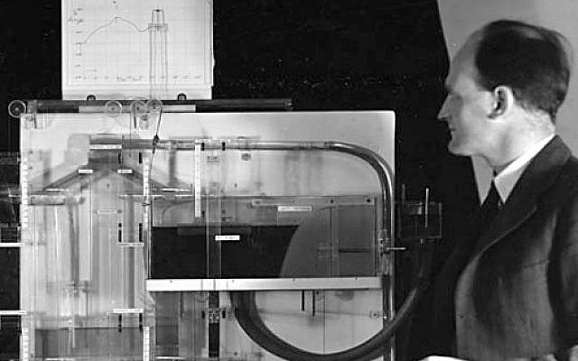 Bill Phillips with his MONIAC computer. (Public Domain/ Wikimedia Commons) Bill Phillips with his MONIAC computer. (Public Domain/ Wikimedia Commons)