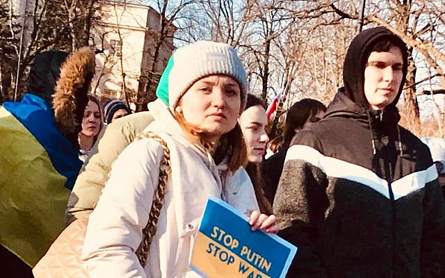 A young woman from Odessa who lives in Warsaw was amongh the thousands  outside Russian Embassy of Poland who protested Putin's War against Urkaine. Photo by Jared Feldschreiber