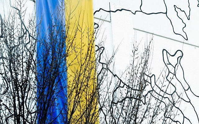 A giant Ukrainian flag flies from a hotel directly across the street from the Russian Embassy in Washington, D.C., March 10, 2022. (Victoria Pickering/Flickr Commons)