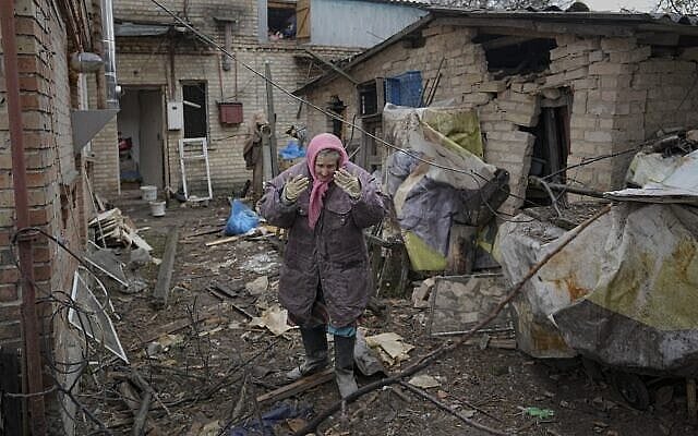 A woman is overwhelmed by emotion in the backyard of a house damaged by a Russian airstrike, according to locals, in Gorenka, outside the capital Kyiv, Ukraine, Wednesday, March 2, 2022. Russia renewed its assault on Ukraine's second-largest city in a pounding that lit up the skyline with balls of fire over populated areas, even as both sides said they were ready to resume talks aimed at stopping the new devastating war in Europe.(AP Photo/Vadim Ghirda) A woman is overwhelmed by emotion in the backyard of a house damaged by a Russian airstrike, according to locals, in Gorenka, outside the capital Kyiv, Ukraine, Wednesday, March 2, 2022. Russia renewed its assault on Ukraine's second-largest city in a pounding that lit up the skyline with balls of fire over populated areas, even as both sides said they were ready to resume talks aimed at stopping the new devastating war in Europe.(AP Photo/Vadim Ghirda)