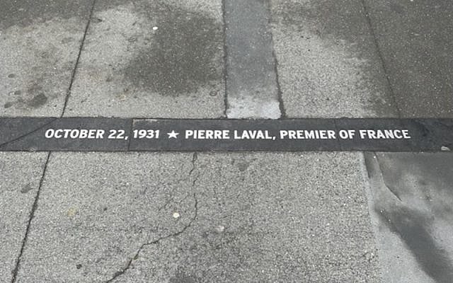 A sidewalk plaque along Manhattan's "Canyon of Heroes" remembers a ticker-tape parade in 1931 honoring Pierre Laval, who would go on to serve as the head of France's Nazi-aligned Vichy government. (Jacob Fishman) A sidewalk plaque along Manhattan's "Canyon of Heroes" remembers a ticker-tape parade in 1931 honoring Pierre Laval, who would go on to serve as the head of France's Nazi-aligned Vichy government. (Jacob Fishman)