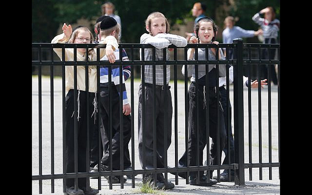 Illustrative: Boys outside a school in the Hasidic enclave of Kiryas Joel, N.Y. July 1, 2014 (AP/Mike Groll)