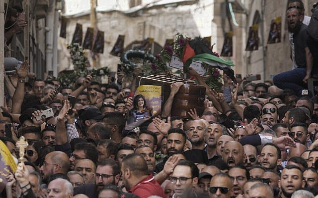 Mourners carry the casket of slain Al Jazeera veteran journalist Shireen Abu Akleh during her funeral in Jerusalem's Old City , Friday, May 13, 2022. Abu Akleh, a Palestinian-American reporter who covered the Mideast conflict for more than 25 years, was shot dead Wednesday during an Israeli military raid in the West Bank town of Jenin. (AP Photo/Mahmoud Illean)