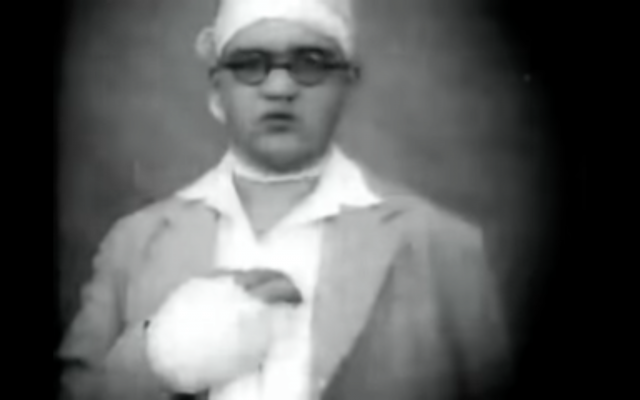 An screenshot of Moe Harbater with his injuries from documentary film footage taken following the 1929 riots (YouTube)