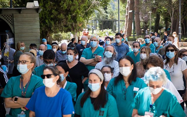 Doctors and nurses strike outside the Hadassah hospital in Jerusalem on August 25, 2021. Staff at public hospitals all over Israel were protesting the lack of budget for the Israeli healthcare system. (Yonatan Sindel/Flash90) Doctors and nurses strike outside the Hadassah hospital in Jerusalem on August 25, 2021. Staff at public hospitals all over Israel were protesting the lack of budget for the Israeli healthcare system. (Yonatan Sindel/Flash90)