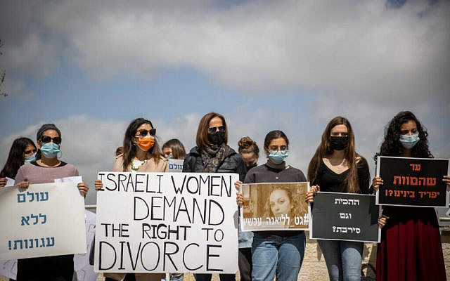 Women's rights activists protest outside the Rabbinical Court in Jerusalem March 8, 2021, during women's day. Photo by Yonatan Sindel/Flash90 Women's rights activists protest outside the Rabbinical Court in Jerusalem March 8, 2021, during women's day. Photo by Yonatan Sindel/Flash90