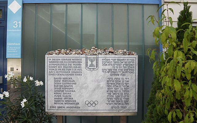 A memorial plaque for the eleven athletes from Israel and one German police officer were killed in a terrorist attack during the Olympic Games 1972, stands at the former accommodation of the Israeli team in the Olympic village in Munich, Germany, Aug. 27, 2022. (Matthias Schrader/AP)