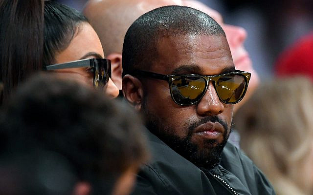 Kanye West watches an NBA basketball game in Los Angeles, January 13, 2020. (AP Photo/Mark J. Terrill)