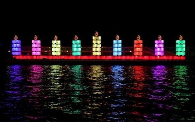 Menorah lights in Israel on the sea. Photo courtesy of Hadassah.
