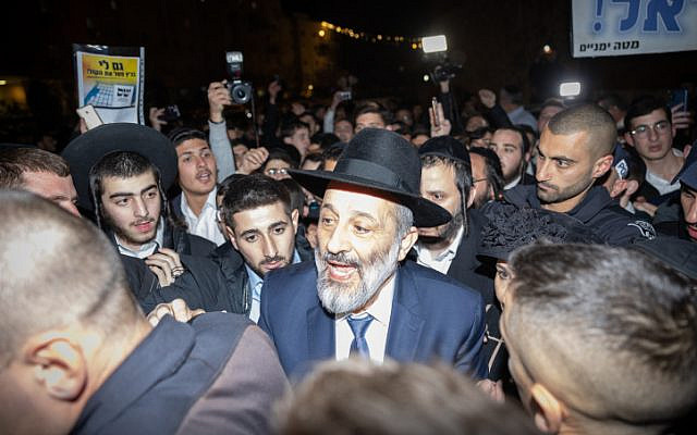 Shas chief Aryeh Deri seen outside his home in Jerusalem on January 18, 2023, hours after the High Court ruled he cannot serve as minister. (Yonatan Sindel/Flash90)