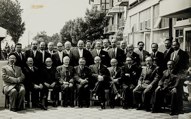 A photograph of one conference of Orthodox Ministers together with Chief Rabbi Brodie (fifth left), with Louis Jacobs in attendance (standing fourth right).