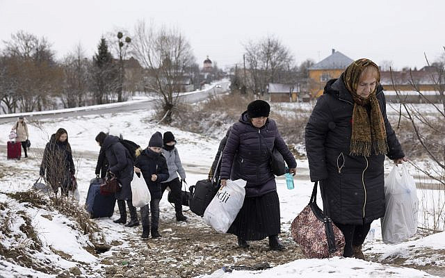 Refugees fleeing conflict make their way to the Krakovets border crossing with Poland on March 9, 2022 in Krakovets, Ukraine. More than a million people have fled Ukraine following Russia's large-scale assault on the country, with hundreds of thousands of Ukrainians passing through Lviv on their way to Poland. (Dan Kitwood/Getty Images) Refugees fleeing conflict make their way to the Krakovets border crossing with Poland on March 9, 2022 in Krakovets, Ukraine. More than a million people have fled Ukraine following Russia's large-scale assault on the country, with hundreds of thousands of Ukrainians passing through Lviv on their way to Poland. (Dan Kitwood/Getty Images)
