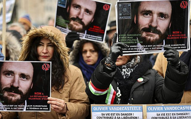 People at a demonstration in Brussels hold placards calling to free Belgian aid worker Olivier Vandecasteele, who was detained in Iran. Sunday, Jan. 22, 2023. (AP Photo/Olivier Matthys) People at a demonstration in Brussels hold placards calling to free Belgian aid worker Olivier Vandecasteele, who was detained in Iran. Sunday, Jan. 22, 2023. (AP Photo/Olivier Matthys)