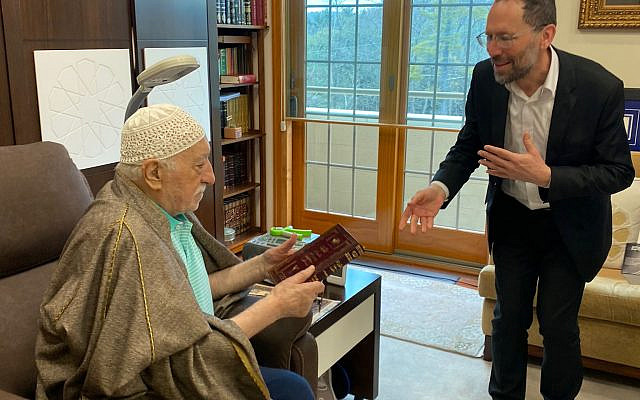 Handing the Torah in Arabic to  Fethullah Gulen. Credit: Nagen