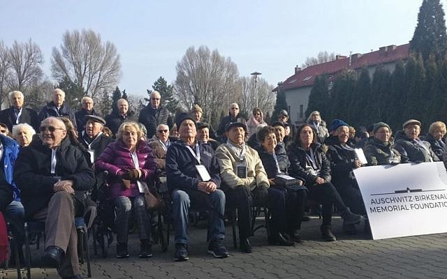 Dugo sits among survivors singing Hatikva outside Auschwitz, 27 January 2020 (credit Zak Jeffay)