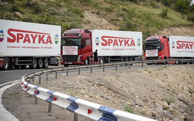 Armenian trucks carrying humanitarian aid for the Armenian-populated breakaway Nagorno-Karabakh region are seen stranded not far away from an Azerbaijani checkpoint set up at the entry of the Lachin corridor, Karabakh's only land link with Armenia, on July 30, 2023. (Karen Minasyan / AFP) Armenian trucks carrying humanitarian aid for the Armenian-populated breakaway Nagorno-Karabakh region are seen stranded not far away from an Azerbaijani checkpoint set up at the entry of the Lachin corridor, Karabakh's only land link with Armenia, on July 30, 2023. (Karen Minasyan / AFP)