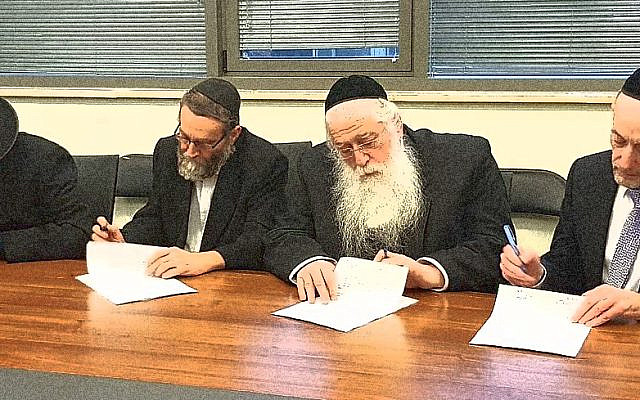 Haredi MPs signing election agreements. (Wikimedia Commons)