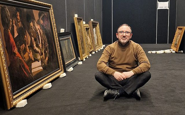 Arunas Gelunas rejoices at the safe arrival of the masterpieces from the Boris Voznytsky National Gallery in Lviv. Next to Arunas one can see George de la Tour Payment of Taxes painting dating back to the early 1600s. Photo: Gintare Grigenaite. Credit: (C) LNMA, with kind permission.