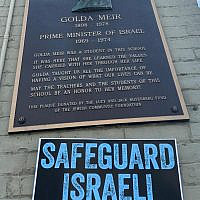Plaque outside Fourth Street School in Milwaukee, Wisconsin, now Golda Meir School, with UnXeptable pro-democracy sign