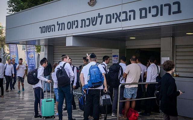 Haredi men who decided to join the military amid the war between Israel and Hamas, at the IDF recruiting offices in Tel Hashomer, near Tel Aviv, October 23, 2023. (Avshalom Sassoni/Flash90) Haredi men who decided to join the military amid the war between Israel and Hamas, at the IDF recruiting offices in Tel Hashomer, near Tel Aviv, October 23, 2023. (Avshalom Sassoni/Flash90)