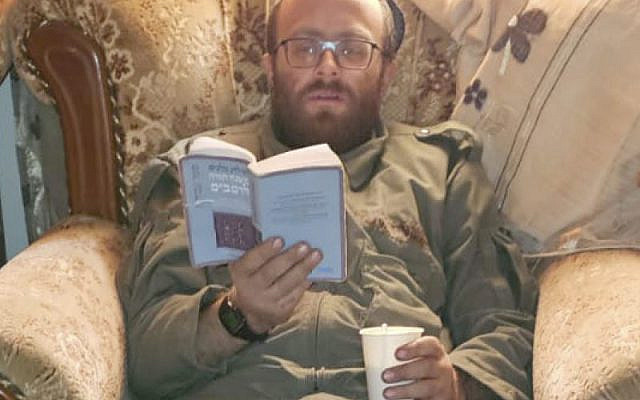 Hours before being killed, Rabbi Elisha Lowenstern takes a break from fighting and studies the daily section of Maimonides' Mishneh Torah in Gaza. Hours before being killed, Rabbi Elisha Lowenstern takes a break from fighting and studies the daily section of Maimonides' Mishneh Torah in Gaza.
