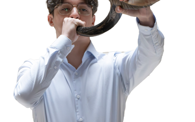 Alex Griner Blows the Shofar (photo credits: Keith Levit)