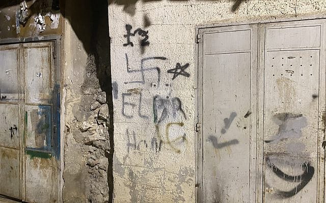 Graffiti of a swastika on a building in the Palestinian city Nablus, 2022