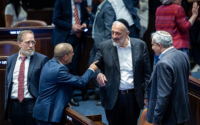 Shas chairman Aryeh Deri and lawmakers attend a plenum session in the Knesset, September 9, 2024. (Yonatan Sindel/ Flash90)