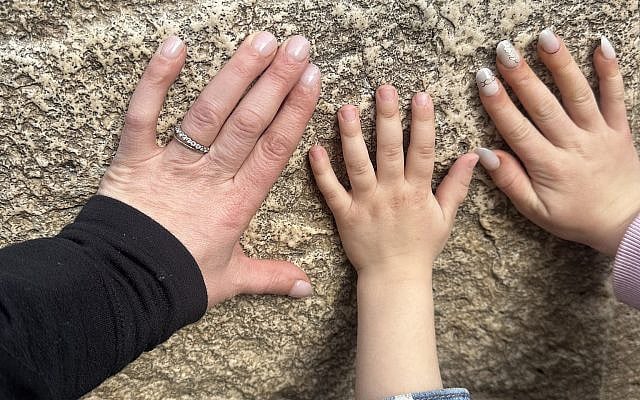 My hands and my daughters hands on the Kotel (Western Wall)
