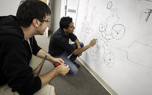 Illustrative: Puneet Puri, right, from India and Alexandr, Borgul, left, Russia, work on a hands free toothbrush in the Innovations Lab on the Singularity University campus on Tuesday, August 6, 2013 in Moffett Field, Calif. (AP Photo/Tony Avelar) Illustrative: Puneet Puri, right, from India and Alexandr, Borgul, left, Russia, work on a hands free toothbrush in the Innovations Lab on the Singularity University campus on Tuesday, August 6, 2013 in Moffett Field, Calif. (AP Photo/Tony Avelar)