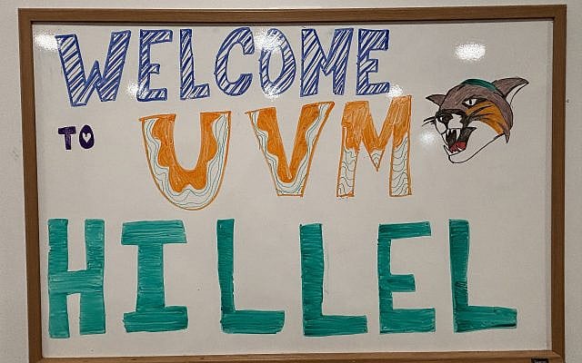 Image courtesy of the author. Sign says "Welcome to UVM Hillel" with our mascot wearing a kippah.