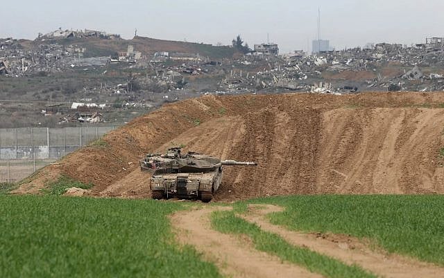 An Israeli army tank stationed on a hill overlooking northern Gaza, on February 12, 2025, taken from the Israel side of the border. (Menahem KAHANA / AFP) An Israeli army tank stationed on a hill overlooking northern Gaza, on February 12, 2025, taken from the Israel side of the border. (Menahem KAHANA / AFP)