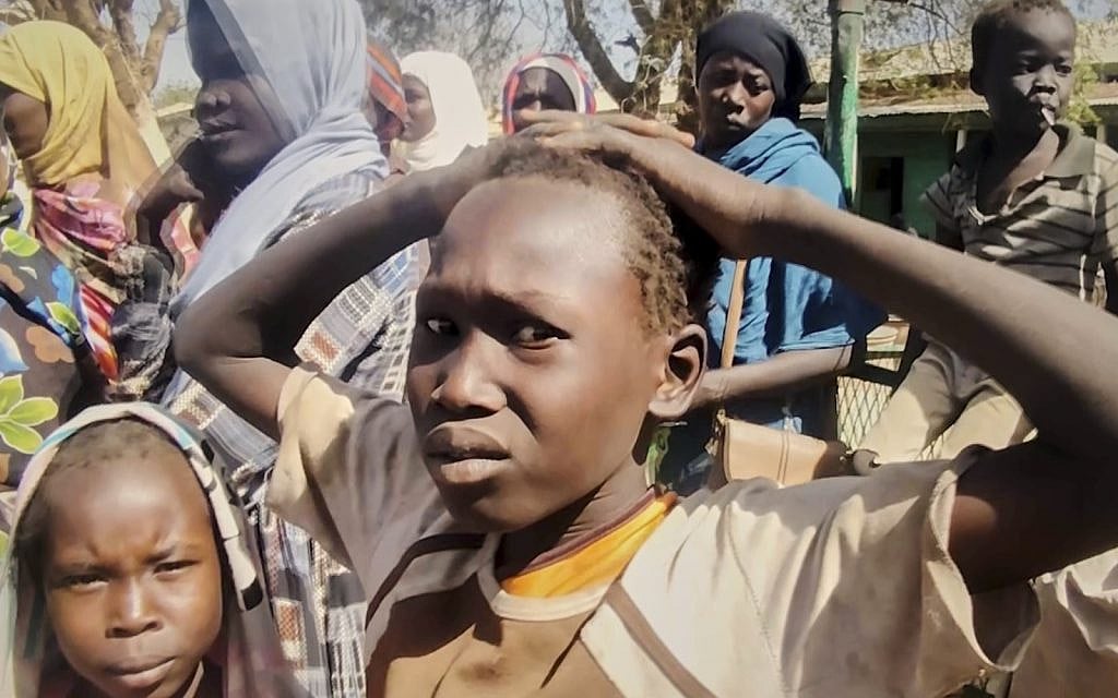 In this video frame, Sudanese displaced children take shelter in a school after being evacuated by the Sudanese army from areas once controlled by the paramilitary Rapid Support Forces in Omdurman, Sudan, located across the Nile River from Khartoum, on Sunday, March 23, 2025. (AP Photo)