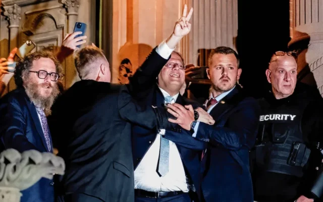 Israeli National Security Minister Itamar Ben-Gvir gestures towards hundreds of pro-Palestinian supporters during a visit to the Yale University John C. Anderson House in New Haven, Connecticut, April 23, 2025. (Roy De La Cruz/SOPA Images/Reuters)