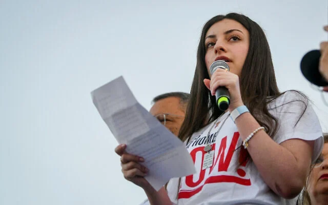 Former hostage Karina Ariev speaks at the start line of the Jerusalem Marathon, April 4, 2025. (Arie Leib Abrams/Flash90) Former hostage Karina Ariev speaks at the start line of the Jerusalem Marathon, April 4, 2025. (Arie Leib Abrams/Flash90)