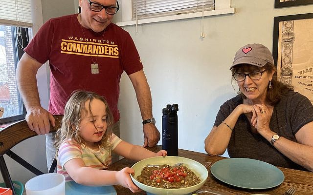 The toddler presenting her eggplant salad to the family. Bon appetit!