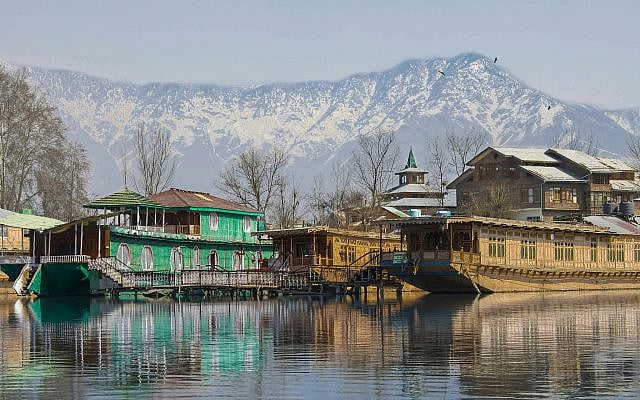Houseboats on Dal Lake in Srinagar, the summer capital of Jammu and Kashmir. (Photo free over Unsplash by Isa Macouzet)